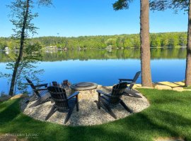 Cozy up next to the gas fire pit with Adirondack chairs overlooking the lake.