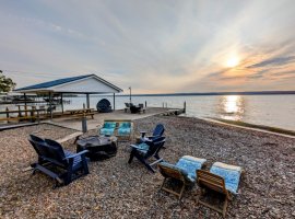 Outdoor space - stone beach and two cement docks -- one covered